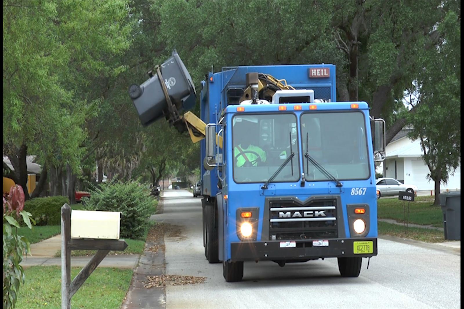 Trash Truck Picking up trash can 