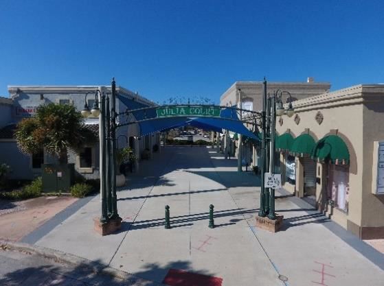 Low aerial photo looking through a courtyard between buildings, a sign reads Julia Court.
