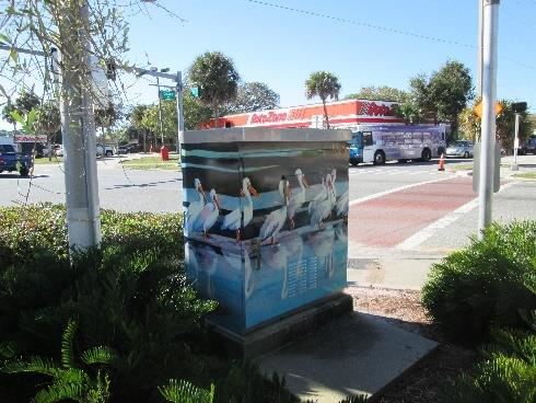 Photo or artwork painted on a traffic signal box.