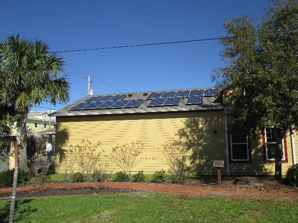 Photo of a building with solar panels on the roof.