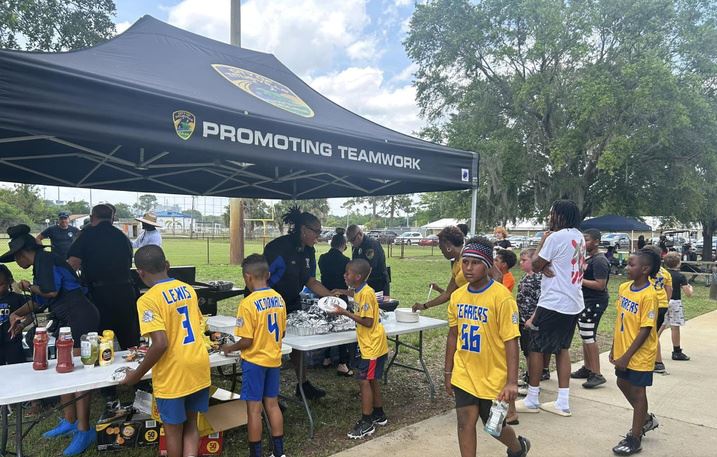 Titusville Police grilled and served hotdogs with all the fixings to community members during the “Cooking Out with Cops” supporting the Titusville Terrier Youth Sports Association