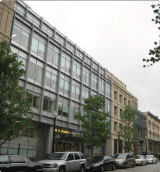 Businesses with Cars on the Street - Photo by La Citta Vitta